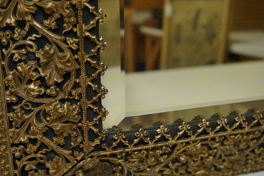 A period-style embossed metal easel mirror, 41cm x 50cm. Condition - easel stand missing now converted to a wall mirror